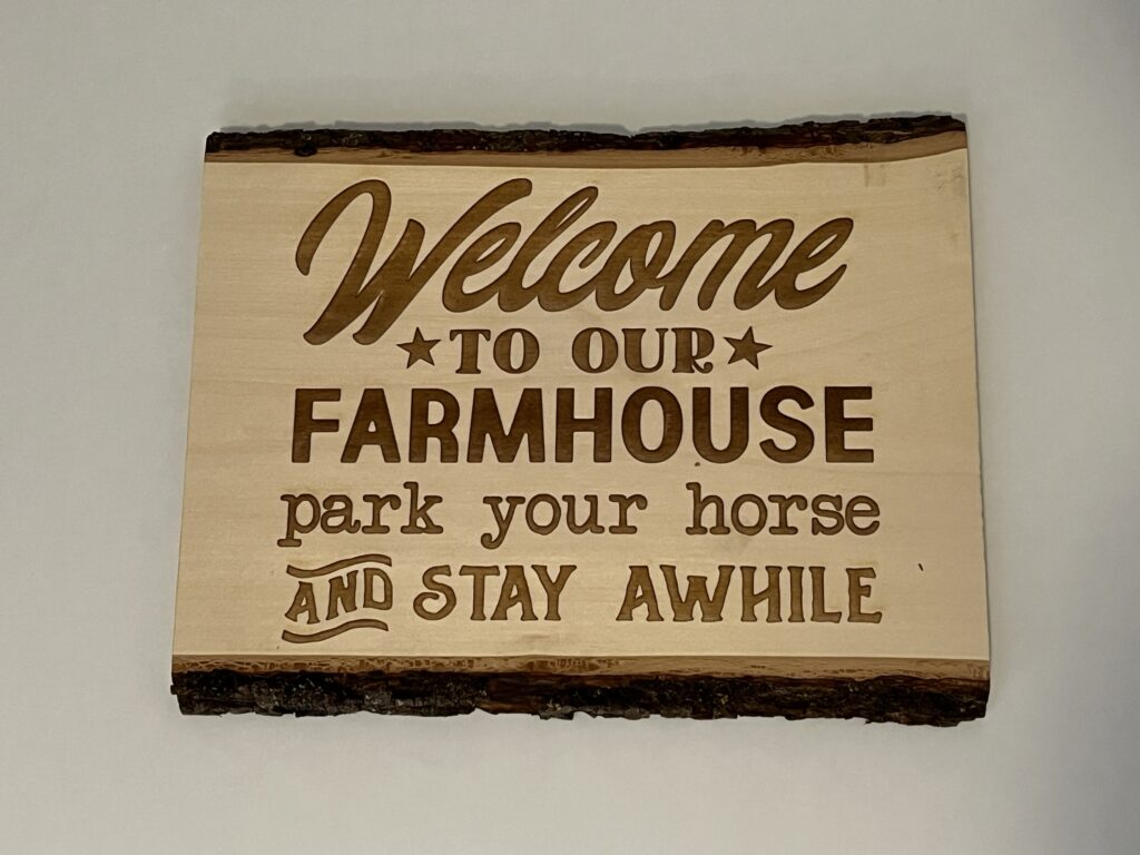 Welcome to Our Farmhouse - Laser Engraved Live Edge Basswood 13"